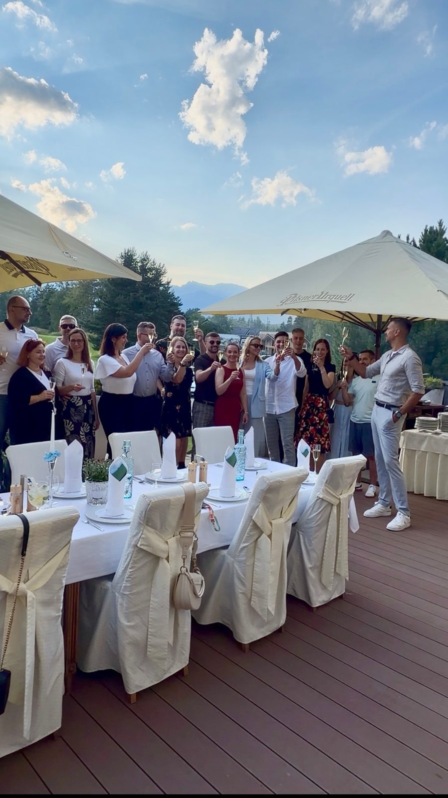 The MNB Solutions team toasting ten years at sunset