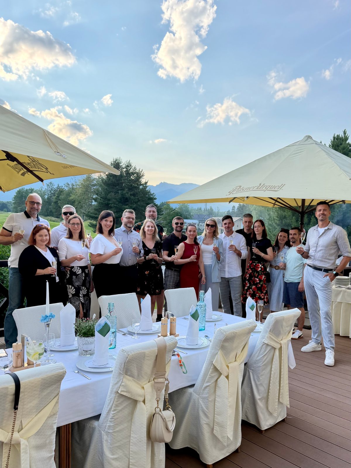 The MNB Solutions team raising a toast at the 10-year anniversary dinner